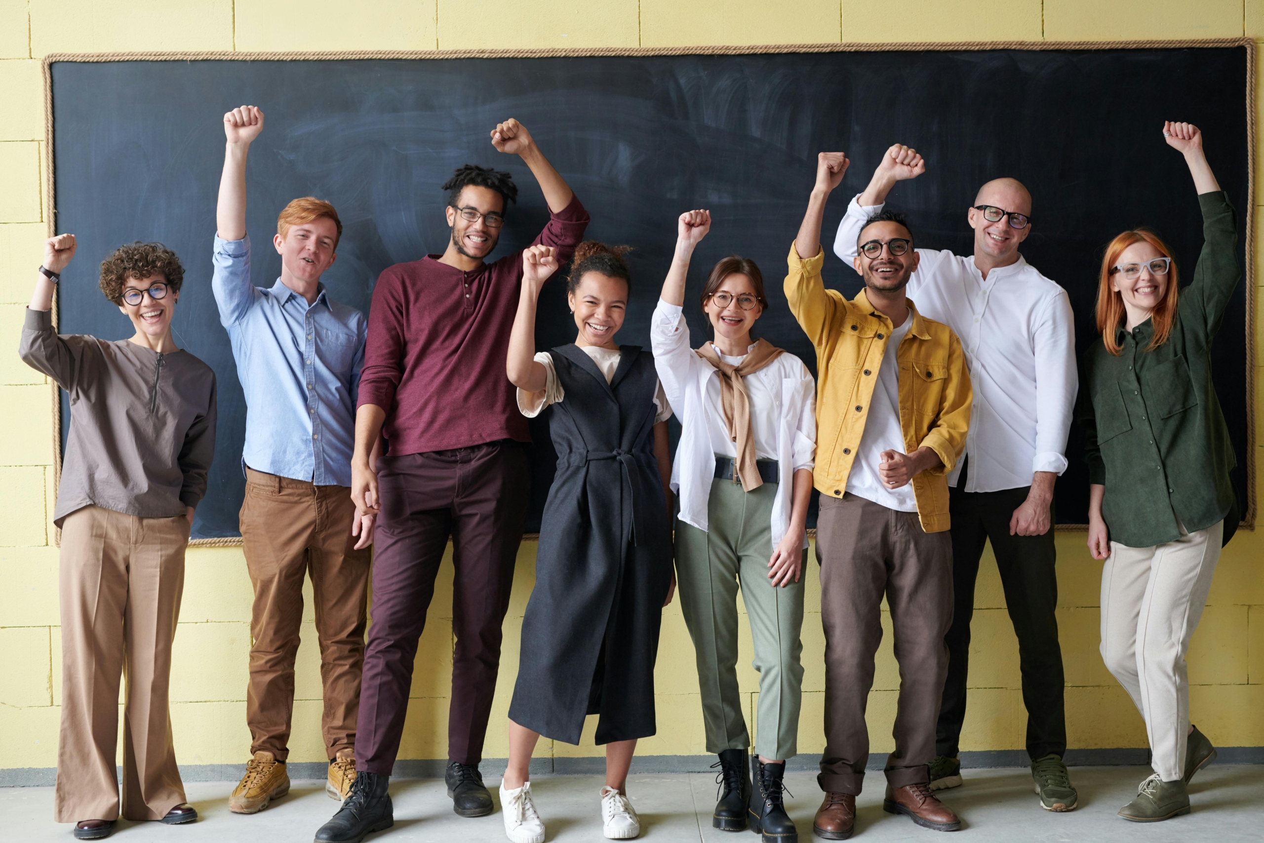 Group of teachers in front of blackboard